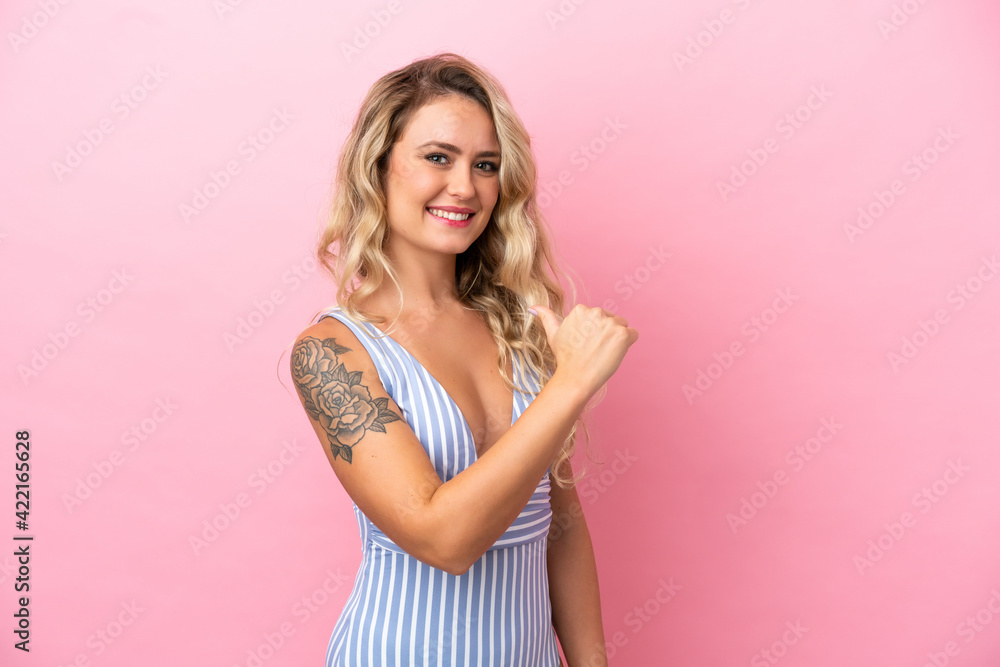 Young Brazilian woman in swimsuit in summer holidays isolated on pink background proud and self-satisfied Young Brazilian woman in swimsuit in summer holidays isolated on pink background proud and self-satisfied