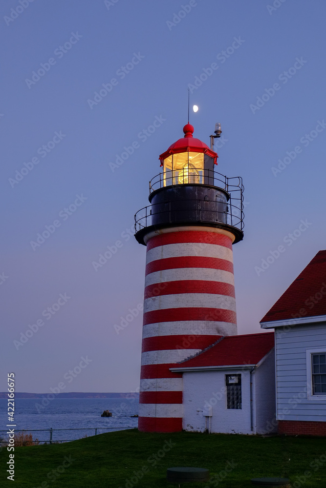 Evening Light and moonrise at the Lubec Lighthouse on the Northern coast of Maine