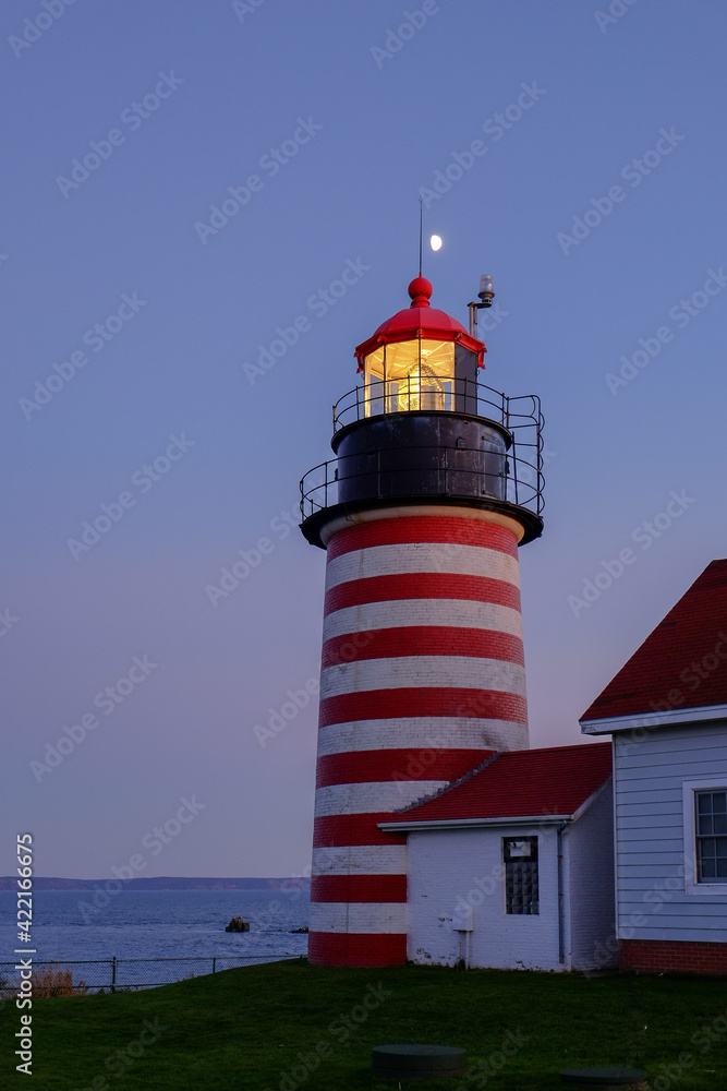 Evening Light and moonrise at the Lubec Lighthouse on the Northern coast of Maine Evening Light and moonrise at the Lubec Lighthouse on the Northern coast of Maine