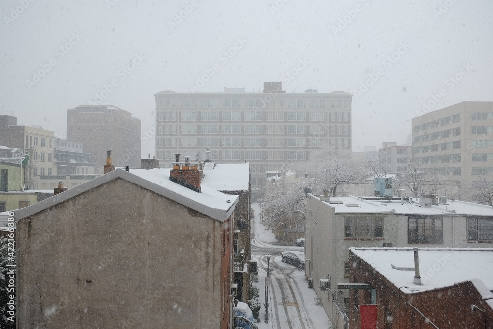 Rooftops in the city of Philadelphia during a fresh snow fall