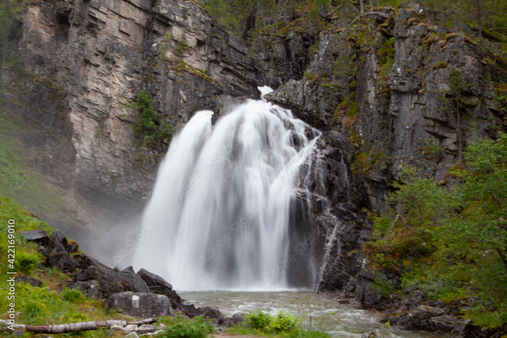 Fototapeta premium Nauståfossen is a beautiful waterfall in Todalen Norway. The waterfall has a drop of 110 meters. the area is known for its clean and distinctive environment