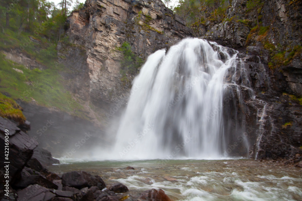 Fototapeta premium Nauståfossen is a beautiful waterfall in Todalen Norway. The waterfall has a drop of 110 meters. the area is known for its clean and distinctive environment