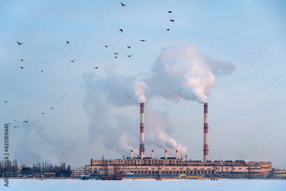 Industrial factory pipes emission carbon gases in atmosphere. Industry zone emission, Factory with thick smoke plumes. Climate change, ecology and global warming
