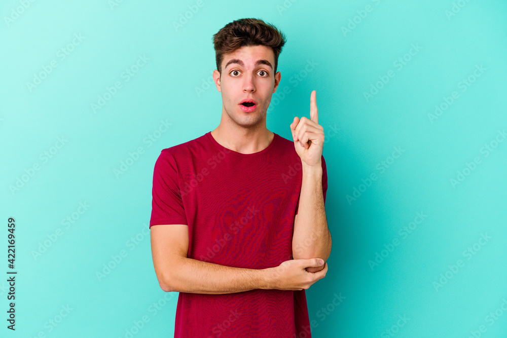 Young caucasian man isolated on blue background having some great idea, concept of creativity. Young caucasian man isolated on blue background having some great idea, concept of creativity.