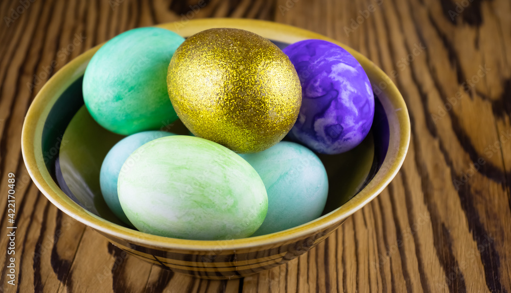 image of Easter holiday eggs on the table close-up.Golden egg. image of Easter holiday eggs on the table close-up.Golden egg.