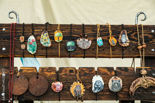 Obraz na płótnie Assorted hand-painted wooden jewelry for sale w salonie