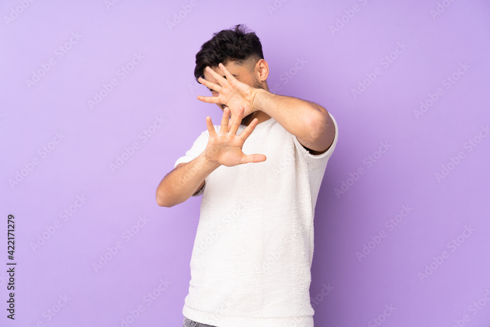 Arabian handsome man over isolated background nervous stretching hands to the front Arabian handsome man over isolated background nervous stretching hands to the front