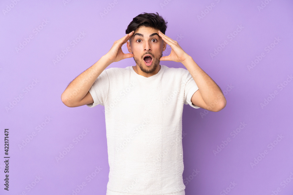 Arabian handsome man over isolated background with surprise expression Arabian handsome man over isolated background with surprise expression
