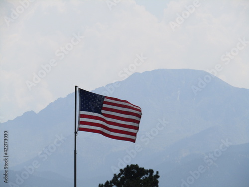 close up of American flag with mountains in the background, United States