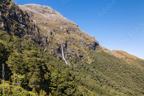 Earland Falls waterfall seen from Routeburn Track in Fiordland National Park, South Island, New Zealand photo