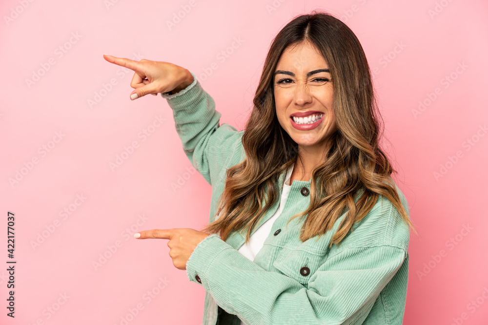 Young caucasian woman isolated excited pointing with forefingers away. Young caucasian woman isolated excited pointing with forefingers away.