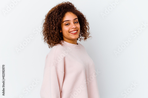 Young african american woman isolated on white background confident keeping hands on hips.