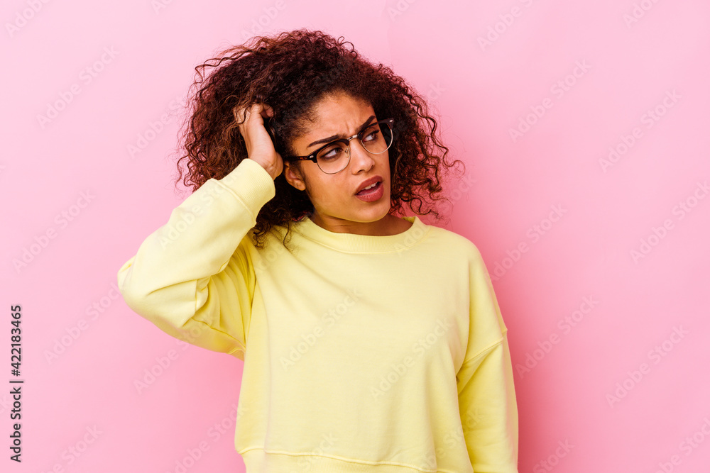 Young african american woman isolated on pink background being shocked, she has remembered important meeting. Young african american woman isolated on pink background being shocked, she has remembered important meeting.