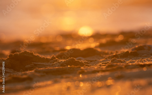 The shine of a sunset on the beach.