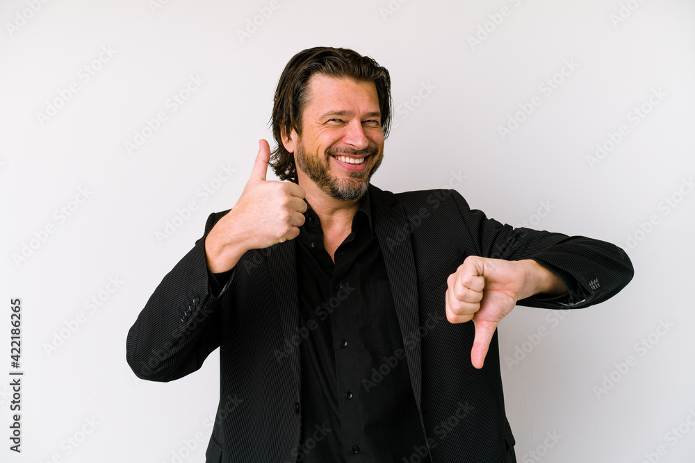 Middle age business dutch man isolated on white background keeps hands under chin, is looking happily aside. Middle age business dutch man isolated on white background keeps hands under chin, is looking happily aside.