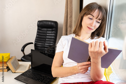 Woman is resting reading a ...