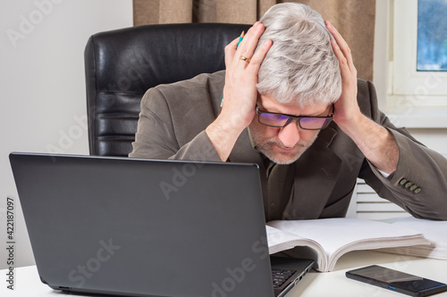 Accountant man holding his ...