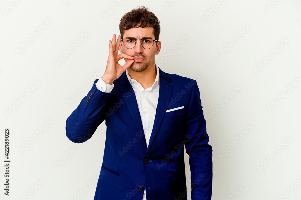 Young business caucasian man isolated on white background with fingers on lips keeping a secret. Young business caucasian man isolated on white background with fingers on lips keeping a secret.