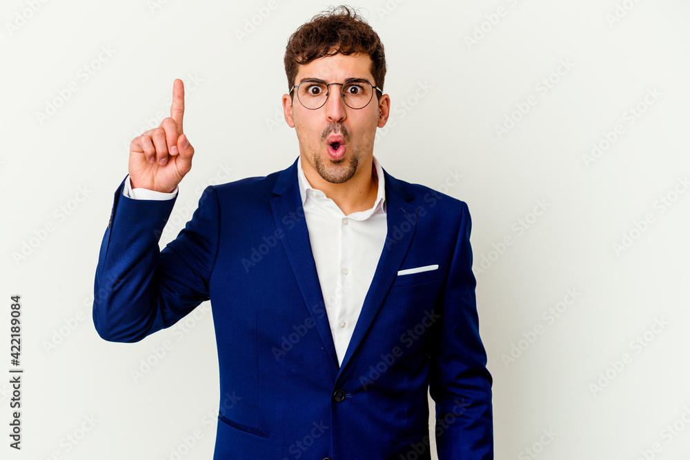 Young business caucasian man isolated on white background pointing upside with opened mouth. Young business caucasian man isolated on white background pointing upside with opened mouth.
