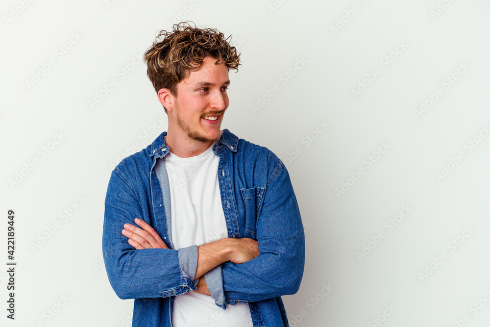 Young caucasian man isolated on white background dreaming of achieving goals and purposes Young caucasian man isolated on white background dreaming of achieving goals and purposes