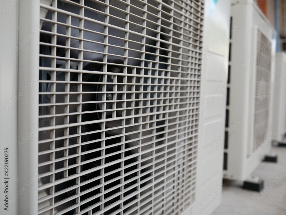 air conditioner compressor outside building.
air conditioner compressor outside building.