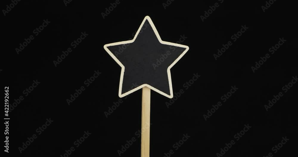 Vertical panorama. A guide pole in the form of a star on a black background. With space for design Vertical panorama. A guide pole in the form of a star on a black background. With space for design