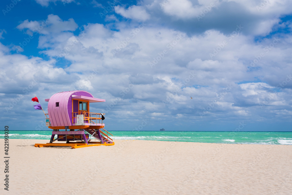 Fototapeta premium Iconic colorful life guard tower at sunny South Beach, Miami-Dade, Florida USA