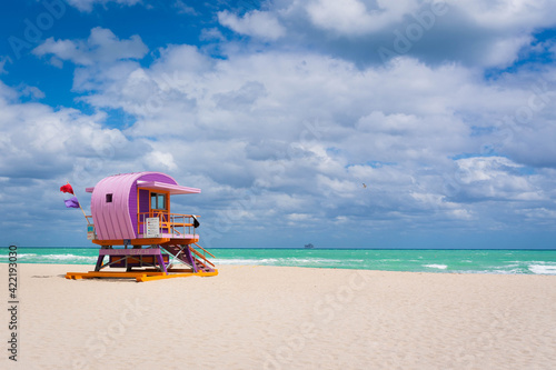Iconic colorful life guard tower at sunny South Beach, Miami-Dade, Florida USA