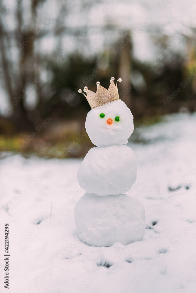 Small snowman with candy face and gold crown Small snowman with candy face and gold crown