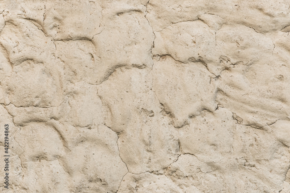 Light beige clay wall with abstract pattern sand texture background Light beige clay wall with abstract pattern sand texture background