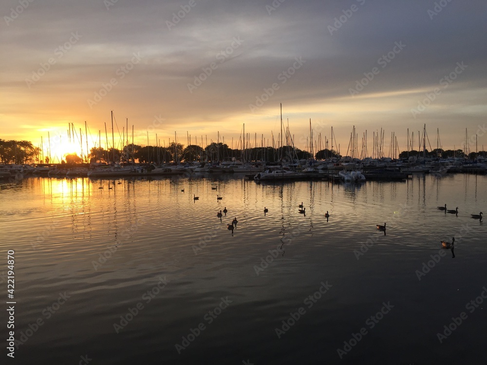 Sunset on the lakes with boats and ducks