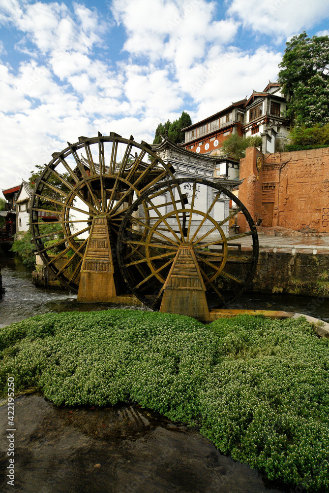 Old wooden water wheels in the ancient Naxi town of Lijiang (Dayan), Yunnan Province, China