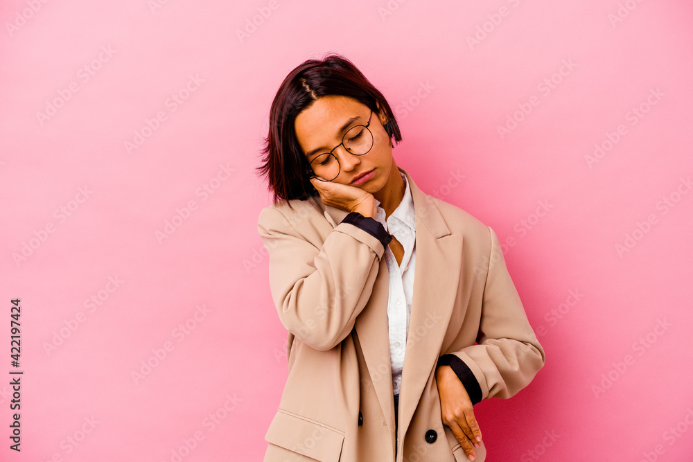 Young business mixed race woman isolated on pink background who is bored, fatigued and need a relax day. Young business mixed race woman isolated on pink background who is bored, fatigued and need a relax day.