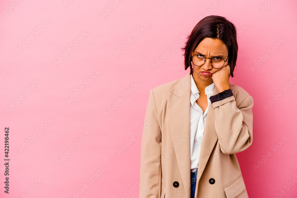 Young business mixed race woman isolated on pink background who feels sad and pensive, looking at copy space. Young business mixed race woman isolated on pink background who feels sad and pensive, looking at copy space.