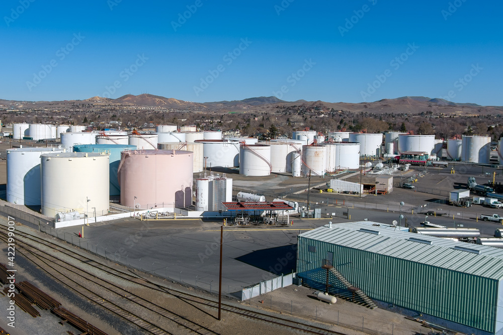 Aerial view of a Petroleum fuel storage tank farm near some railroad tracks. Aerial view of a Petroleum fuel storage tank farm near some railroad tracks.