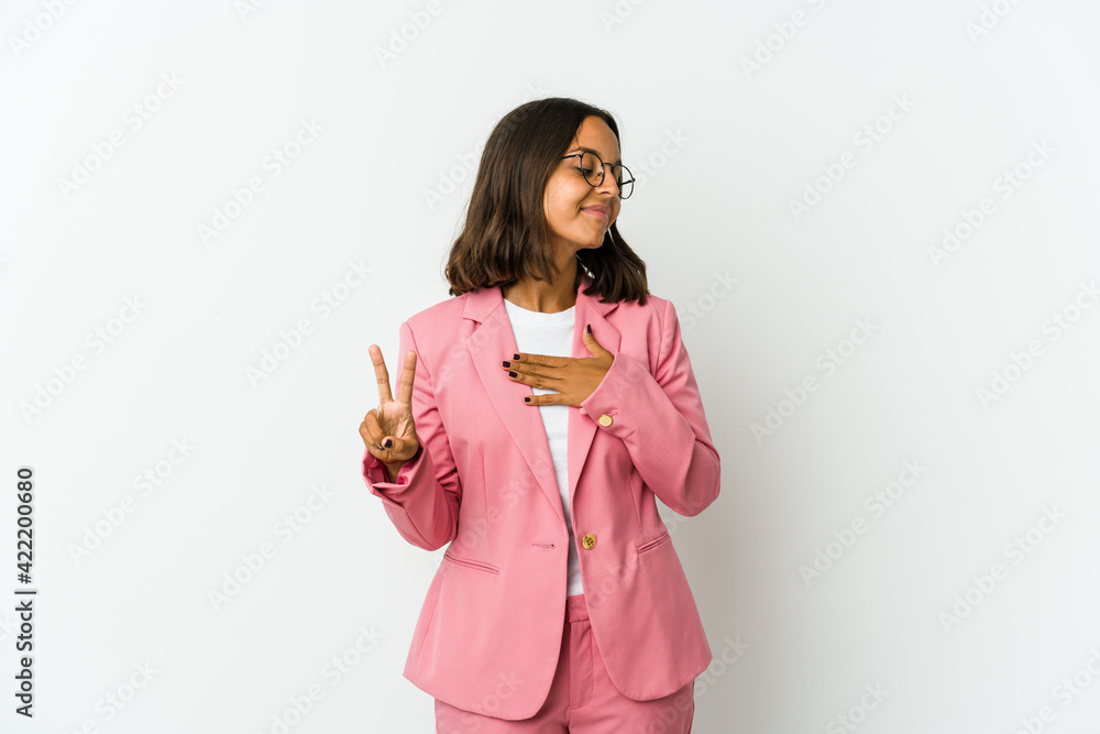 Young latin business woman isolated on white background suffering a back pain. Young latin business woman isolated on white background suffering a back pain.