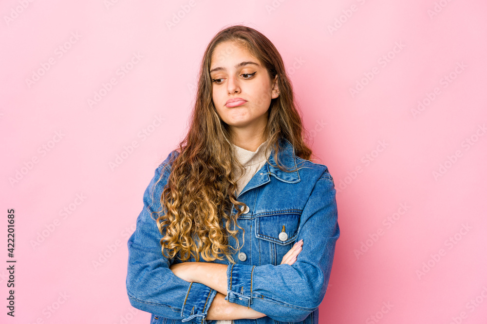 Fototapeta premium Young caucasian woman tired of a repetitive task.
