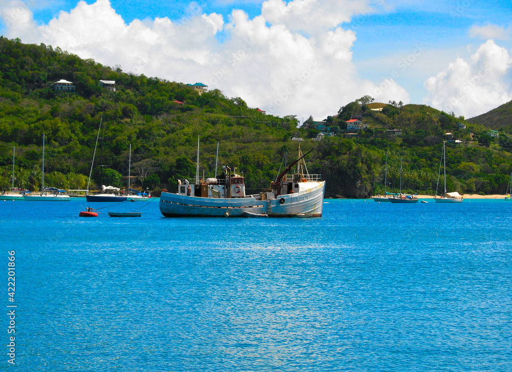 A cruising trawler anchored in Bequia, St Vincent and the Grenadines, Caribbean lesser Antilles.