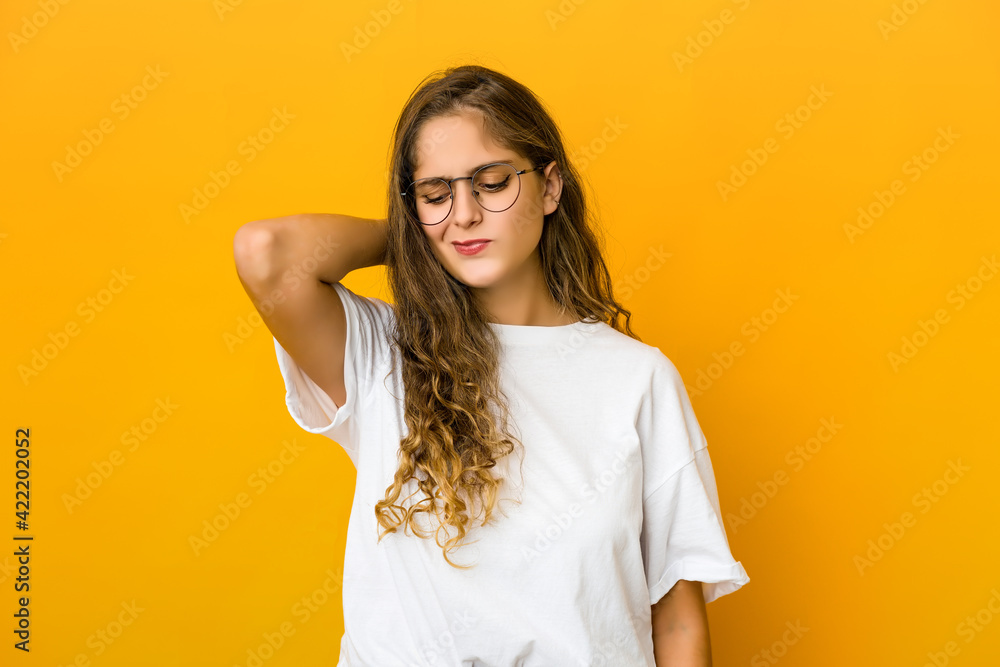 Young caucasian woman suffering neck pain due to sedentary lifestyle. Young caucasian woman suffering neck pain due to sedentary lifestyle.