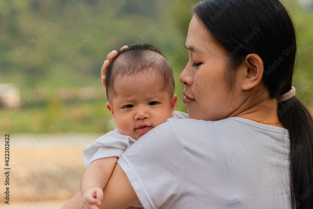 Young Asian mother holding little daughter in the park, Mother play enjoying with her cute baby girl outdoor, copy space
Young Asian mother holding little daughter in the park, Mother play enjoying with her cute baby girl outdoor, copy space