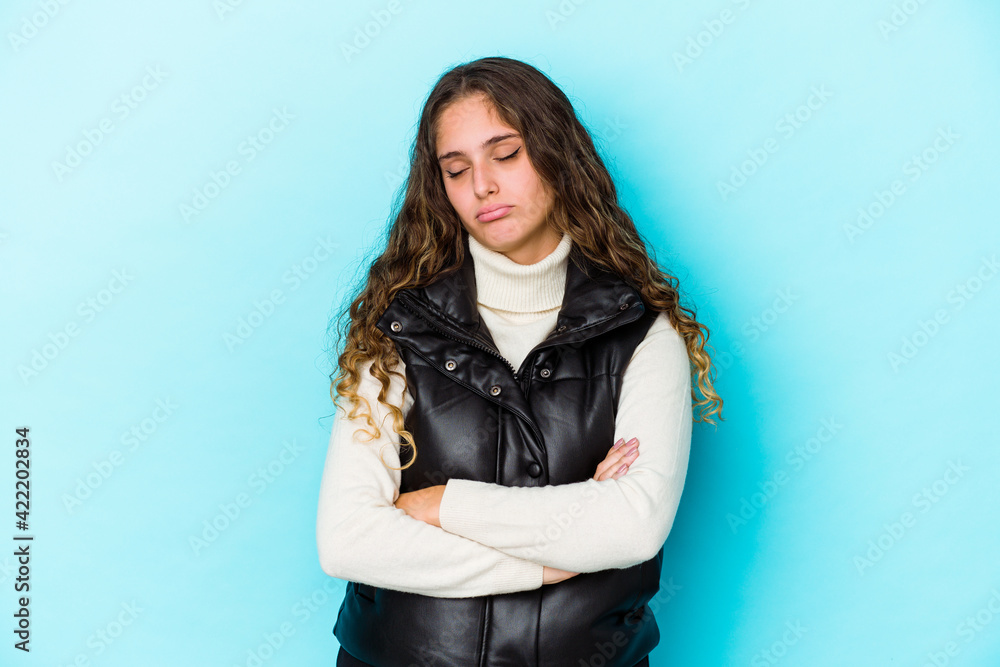 Young caucasian curly hair woman isolated tired of a repetitive task. Young caucasian curly hair woman isolated tired of a repetitive task.