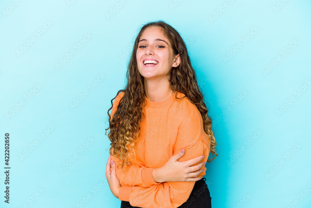 Young caucasian curly hair woman isolated laughing and having fun. Young caucasian curly hair woman isolated laughing and having fun.