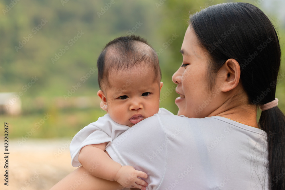 Young Asian mother holding little daughter in the park, Mother play enjoying with her cute baby girl outdoor, copy space
Young Asian mother holding little daughter in the park, Mother play enjoying with her cute baby girl outdoor, copy space