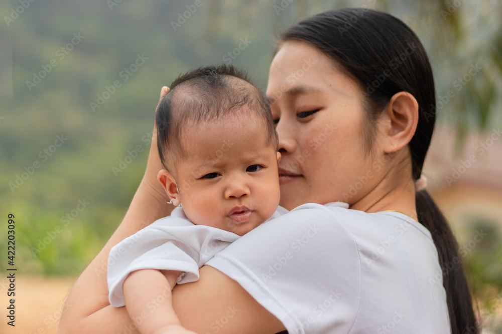 Young Asian mother holding little daughter in the park, Mother play enjoying with her cute baby girl outdoor, copy space
Young Asian mother holding little daughter in the park, Mother play enjoying with her cute baby girl outdoor, copy space
