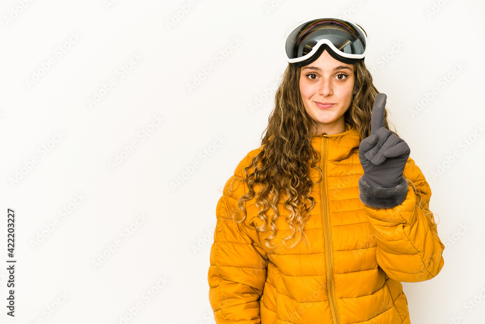 Young caucasian snowboarder woman isolated showing number one with finger.