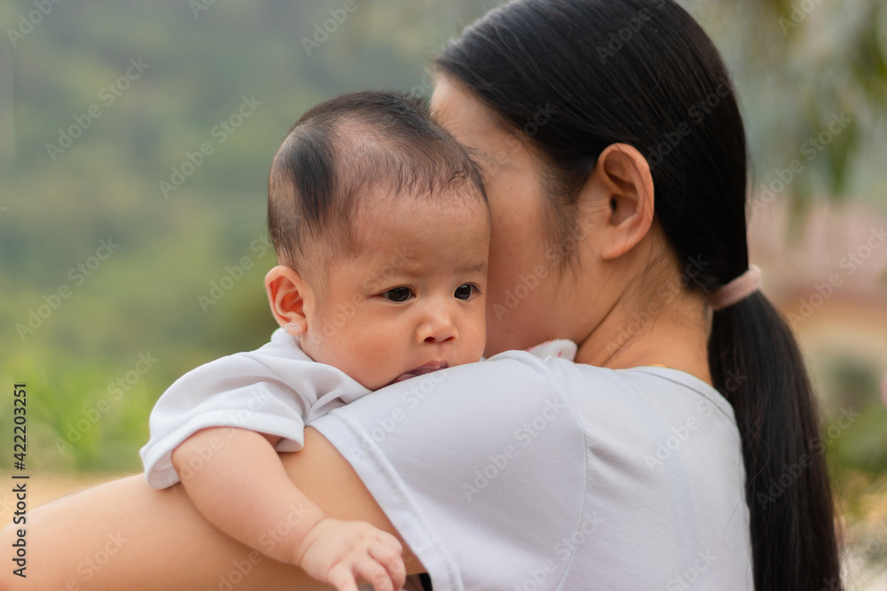 Young Asian mother holding little daughter in the park, Mother play enjoying with her cute baby girl outdoor, copy space
Young Asian mother holding little daughter in the park, Mother play enjoying with her cute baby girl outdoor, copy space