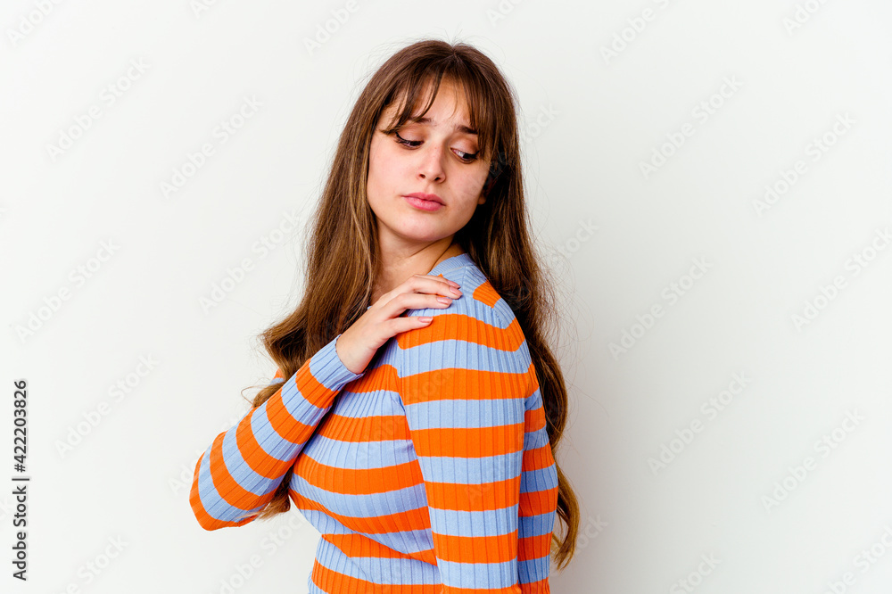 Young caucasian cute woman isolated on white background having a shoulder pain. Young caucasian cute woman isolated on white background having a shoulder pain.
