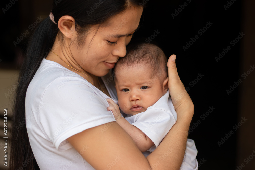 Young Asian mother kissing and holding little daughter in the park, Mother play enjoying with her cute baby girl in outdoor, copy space
Young Asian mother kissing and holding little daughter in the park, Mother play enjoying with her cute baby girl in outdoor, copy space