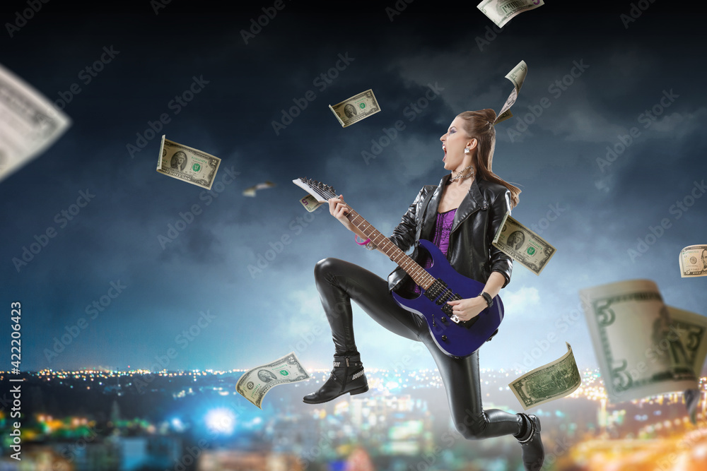 Young and beautiful rock girl playing the electric guitar Young and beautiful rock girl playing the electric guitar