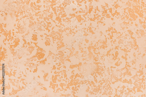 Light abstract sand plaster pattern wall texture orange stucco background